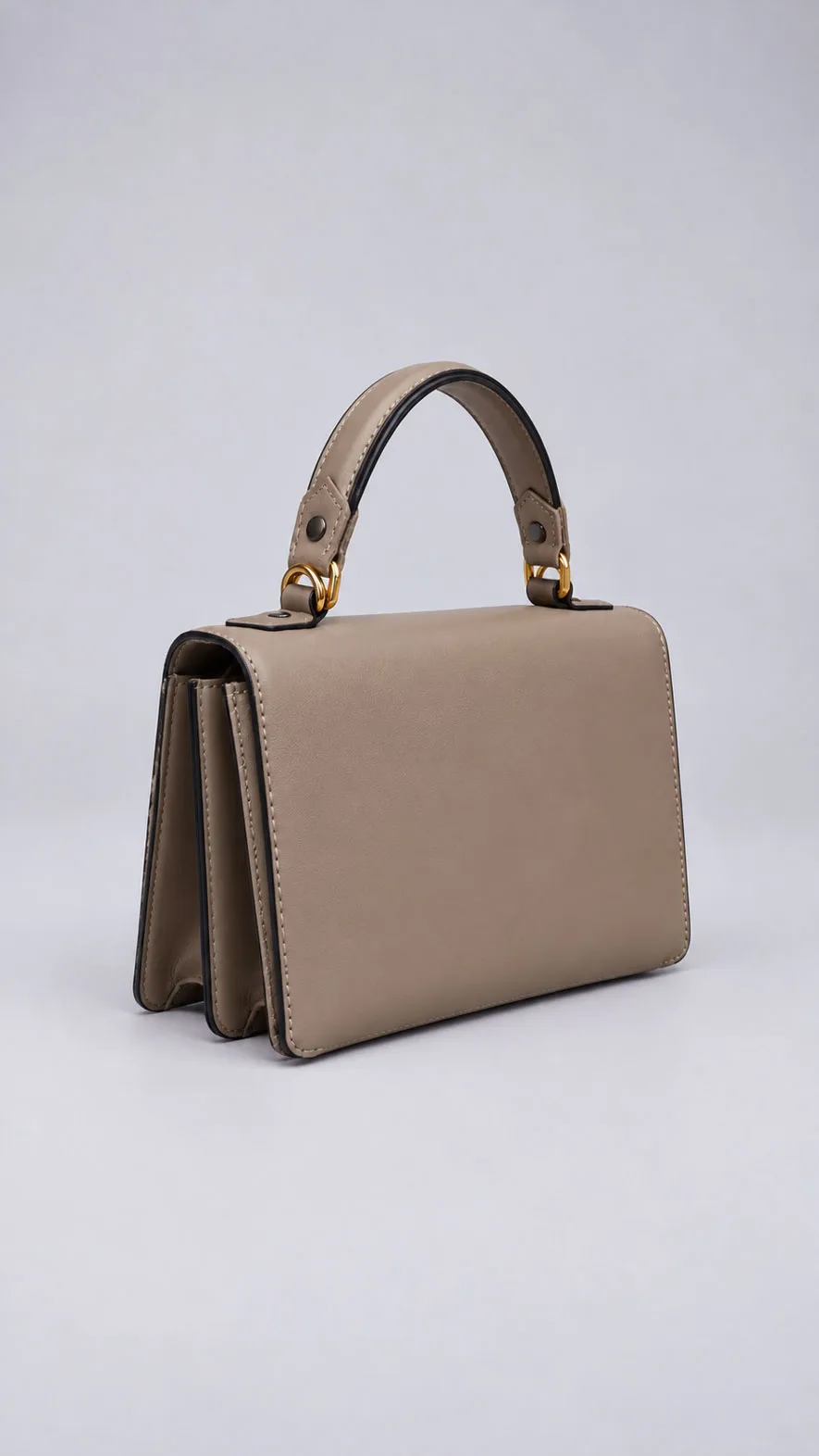 HB0779 taupe minimalist leather handbag showing layered side gussets, angled view