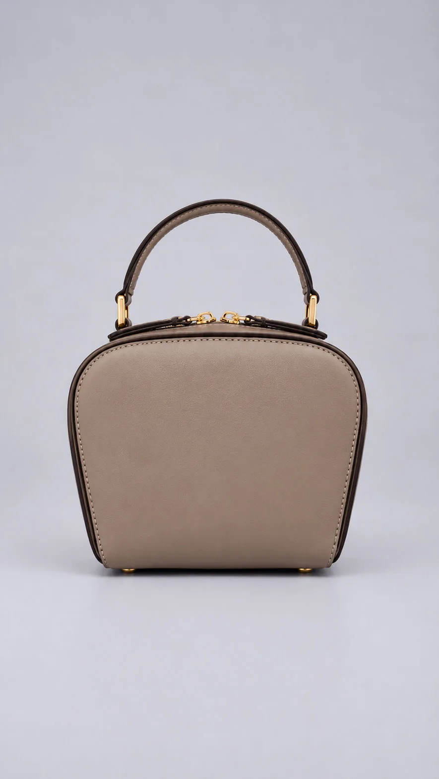 HB0443 taupe dome-shaped leather handbag with top handle and gold hardware, front view